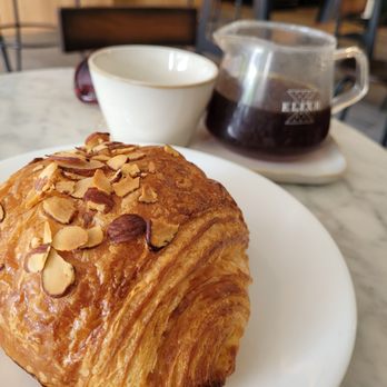 Elixr Coffee Roasters - Almond croissant and a pour over La Palma Y El Tucan - Cafes Near Me - State College, Pennsylvania Elixr Coffee Roasters - Almond croissant and a pour over La Palma Y El Tucan - Cafes Near Me - State College, Pennsylvania