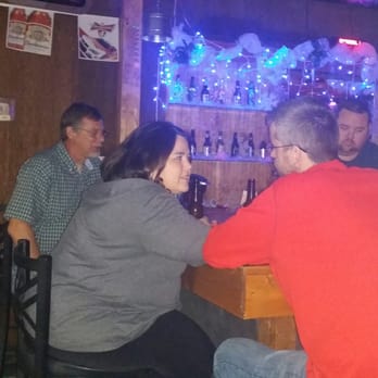 Still Cluckin - a group of people sitting at a bar - Bars Near Me - Providence, North Carolina