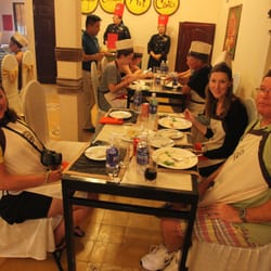 Mary and our friends learning how to cook in Vietnam.