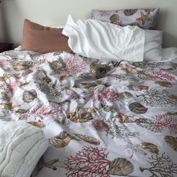 Unmade beds from previous guests. Unmade beds from previous guests.