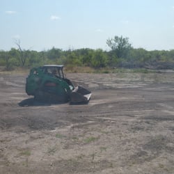 Alamo Transport - Out leveling the septic after the rains settled around it. He could've just filled the holes but he leveled the whole back again