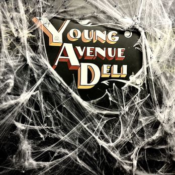 Young Avenue Deli - spider webs surrounding a sign - Delis Near Me - Memphis, Tennessee Young Avenue Deli - spider webs surrounding a sign - Delis Near Me - Memphis, Tennessee