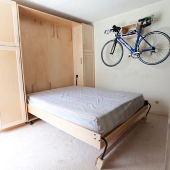 Werk Arts - Murphy bed in open position (bolted into the side cabinets for safety) and bike rack - Furniture Stores Near Me - Honomu, Hawaii