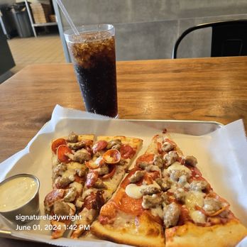Ciro’s Pizza Cafe - Two large slices of pizza with small crispy pepperoni and traditional pepperoni and sausage  on the other slices. - Desserts Near Me - Folsom, California