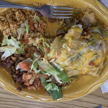 Flying Tortilla Restaurant - Sopapillas stuffed with ground beef and smothered in green chilli verde.    Soooooo good. - Diners Near Me - Santa Fe, New Mexico