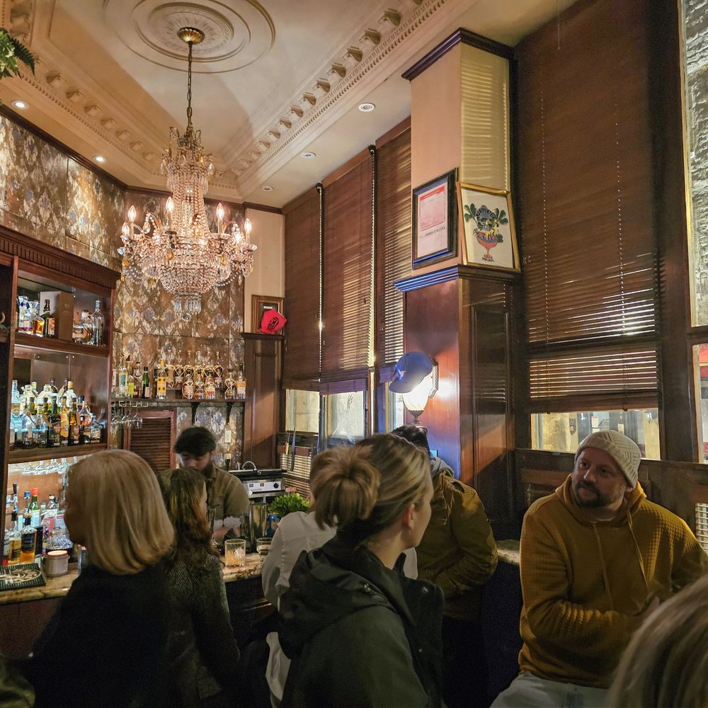 El Pequeño Bar - people sitting at a bar - Cocktail Bars Near Me - Montreal, Quebec
