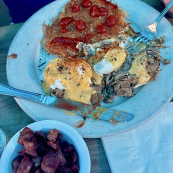No Ka Oi - Kalua Pua'a Benedict: 2 poached eggs, kalua pork, hollandaise sauce, English muffin, breakfast potatoes, side of Portuguese sausage, - Hawaiian Near Me - Huntington Beach, California