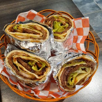 Magic Noodle - a plate of sandwiches wrapped in tin foil - Noodles Near Me - Markham, Ontario Magic Noodle - a plate of sandwiches wrapped in tin foil - Noodles Near Me - Markham, Ontario