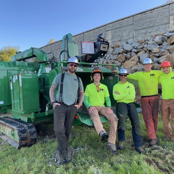 Mountain Air Land Management - Track chipper and crew on land clearing job. - Tree Services Near Me Mountain Air Land Management - Track chipper and crew on land clearing job. - Tree Services Near Me