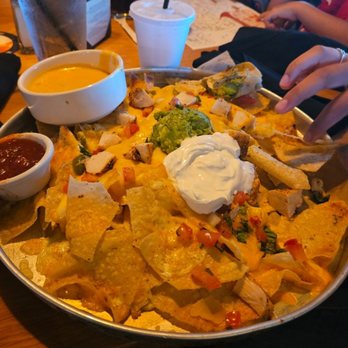 BJ's Restaurant & Brewhouse - Nachos with 6 pieces of chicken and Jalapeños lol - New American Near Me - Bakersfield, California