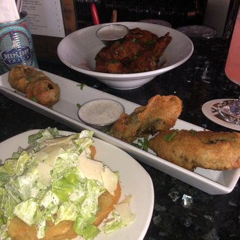 Smith & Kings - Happy hour dishes: wings ($10 for 9) and crostini's ($5 for 2). And the kicking jalapeño poppers ($12 for 4). - Cocktail Bars Near Me - Honolulu, Hawaii