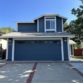 Color Your World Painting - a house with a blue garage door - Flooring Near Me - Sparks, Nevada Color Your World Painting - a house with a blue garage door - Flooring Near Me - Sparks, Nevada