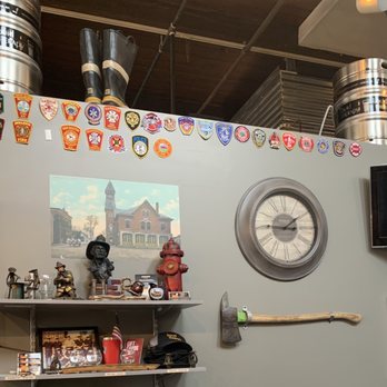Liquid Therapy - a wall with a clock and various items - Breweries Near Me - Nashua, New Hampshire