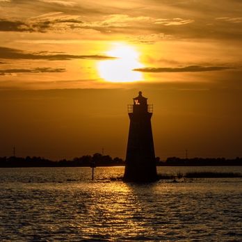 Captain Derek's Dolphin Adventure - Lighthouse in the sunset. - Tours Near Me - Tybee Island, Georgia