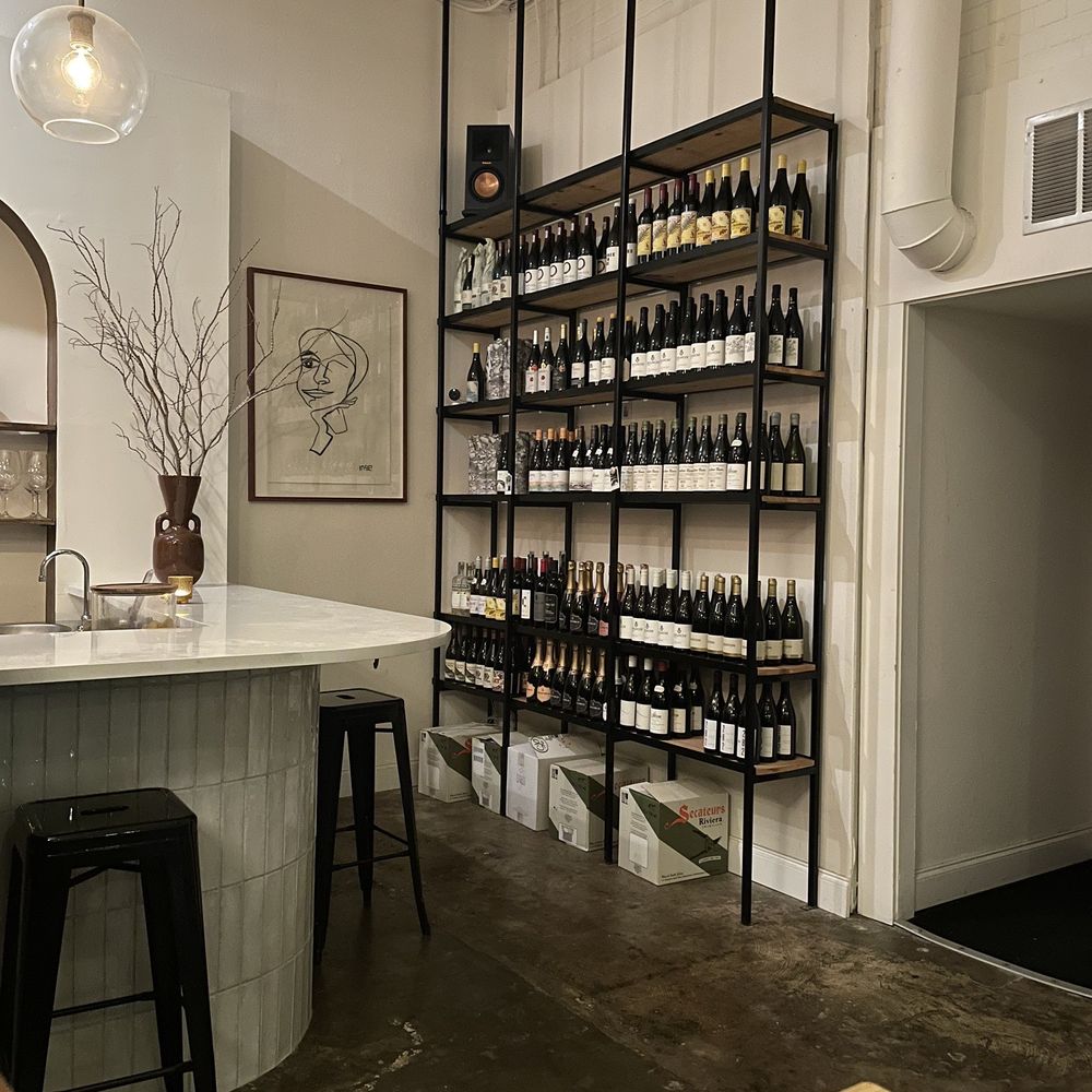 Cape Bottle Room - Corner with one wall of wines - Wine Bars Near Me - Austin, Texas