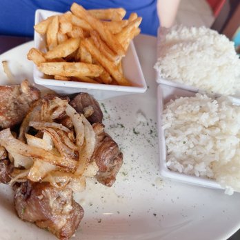 Las Palmas Cuban Restaurant - Masitas de Puerco al Ajillo with complimentary rice & 2 sides - more white rice & French Fries - Cuban Near Me - Mount Dora, Florida Las Palmas Cuban Restaurant - Masitas de Puerco al Ajillo with complimentary rice & 2 sides - more white rice & French Fries - Cuban Near Me - Mount Dora, Florida