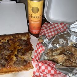 Rocky Rococo Pan Style Pizza - Sausage pizza, garlic Parmesan wings