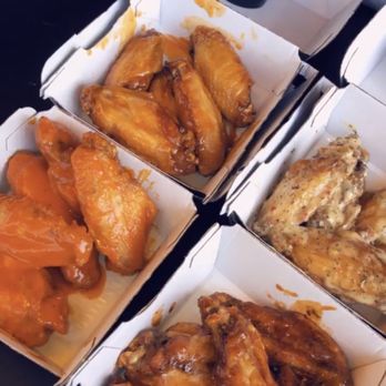 Buffalo Wild Wings - left to right from top: Mango Habanero, Parmesan Garlic, Spicy Garlic, Hot BBQ - Chicken Wings Near Me - Irvine, California Buffalo Wild Wings - left to right from top: Mango Habanero, Parmesan Garlic, Spicy Garlic, Hot BBQ - Chicken Wings Near Me - Irvine, California