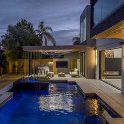 Way To Go Builders, Inc - Full backyard Remodel with wood pool deck, porcelain pavers, full pool remodel, outdoor kitchen and glass railing.