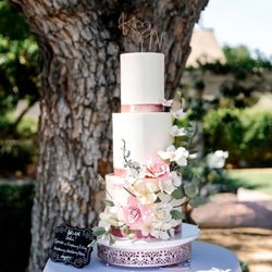 I Got Your Cake - Over the top elegance with this three tiered wedding cake and handmade sugar flowers. $1,500