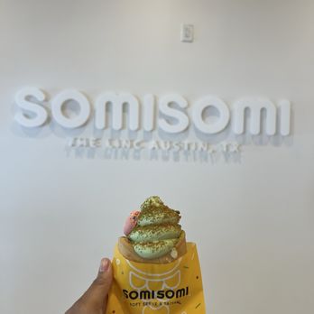Somisomi - Matcha ice cream with custard and biscoff crumbs with a macaron. - Desserts Near Me - Austin, Texas