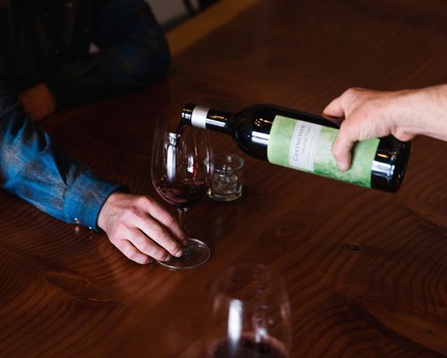 Photo of Covington Cellars - Woodinville, WA, US. a person pouring a glass of wine