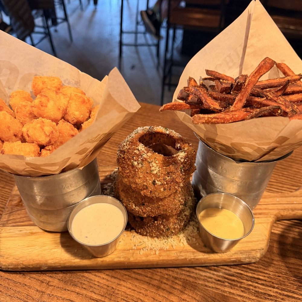 BRGR Kitchen + Bar - Trio sides: tots, Onion Rings & Sweet potato fries - Burgers Near Me - Prairie Village, Kansas BRGR Kitchen + Bar - Trio sides: tots, Onion Rings & Sweet potato fries - Burgers Near Me - Prairie Village, Kansas