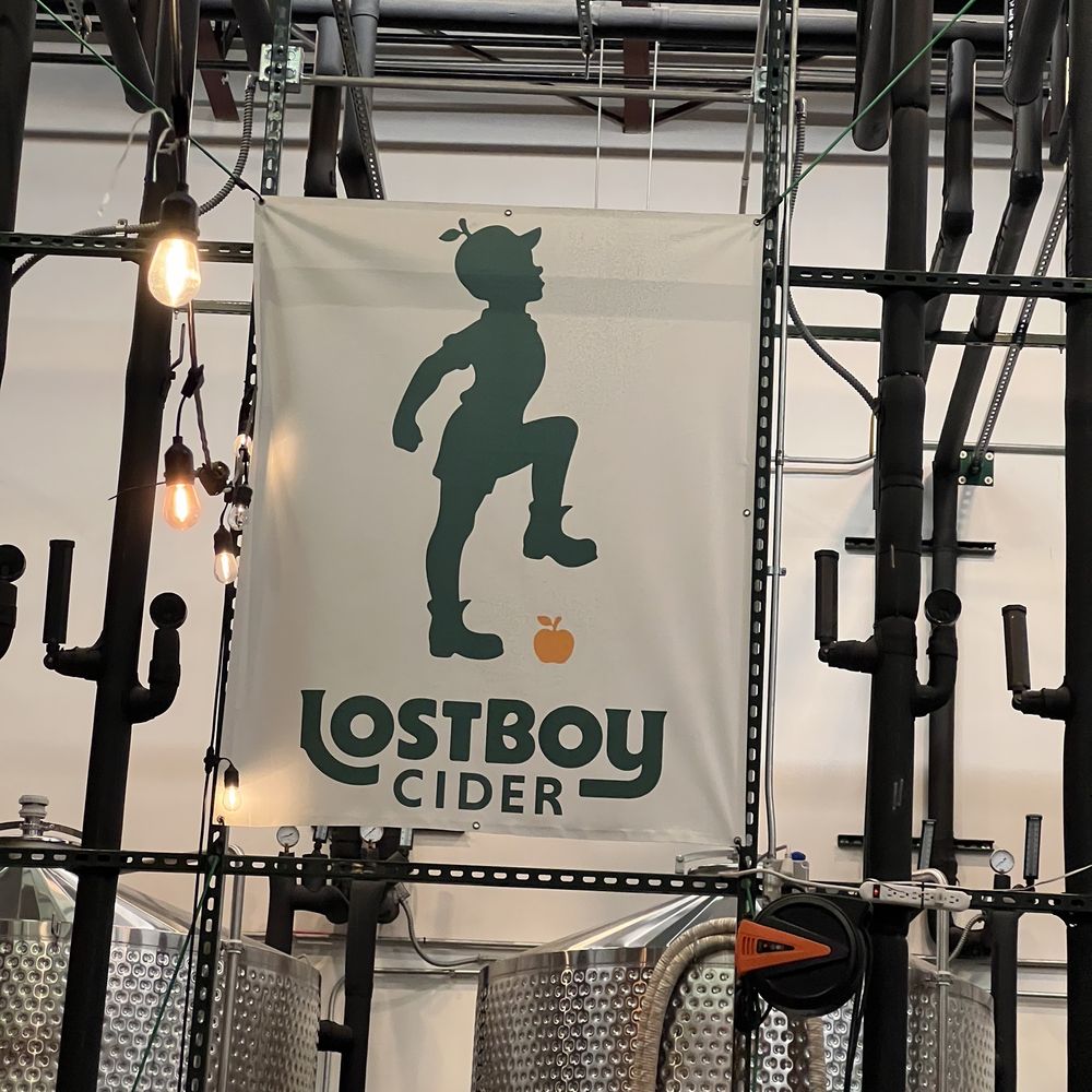 Lost Boy Cider - a banner hanging from the ceiling - Cideries Near Me - Alexandria, Virginia Lost Boy Cider - a banner hanging from the ceiling - Cideries Near Me - Alexandria, Virginia