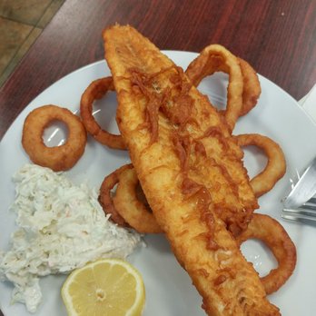 Hillside Grill - Nicely sized fillet with Cole slaw, onion rings, and a lemon wedge (squeeze as you eat so the fish stays crisp!) - Greek Near Me - Northborough, Massachusetts