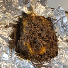 a hamburger wrapped in foil