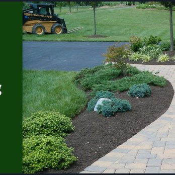 North Landscaping - a walkway in the middle of a garden - Landscaping Near Me North Landscaping - a walkway in the middle of a garden - Landscaping Near Me