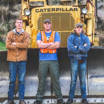 Heavenly Lighthouse Industries - three men standing in front of a bulldozer - Landscaping Near Me Heavenly Lighthouse Industries - three men standing in front of a bulldozer - Landscaping Near Me