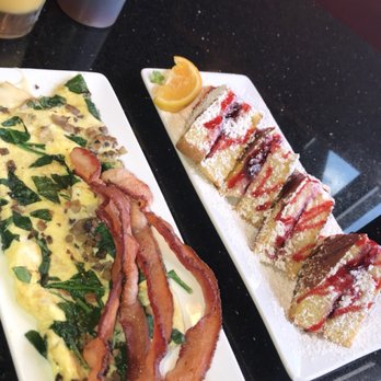 Keke's Breakfast Cafe - Orange juice, stuffed raspberry French toast, bacon, and spinach, mushroom and Swiss omelette - Breakfast & Brunch Near Me - Gainesville, Florida