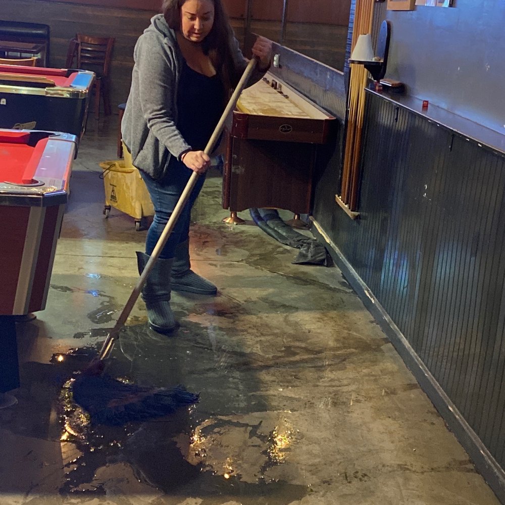 This is bad water spewing from the walls. Katrina trying to help and dry the floor. It's definitely not good!!!