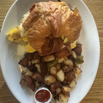 Lola Cafe - Breakfast croissant with bacon, ham, egg, and avocado - yummy. Potatoes on the side - Breakfast & Brunch Near Me - Los Angeles, California Lola Cafe - Breakfast croissant with bacon, ham, egg, and avocado - yummy. Potatoes on the side - Breakfast & Brunch Near Me - Los Angeles, California