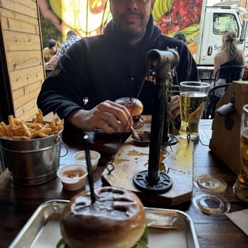 Sid's Garage - I got the Steakhouse Burger, he got the Boss Hog. - Beer Bar Near Me - Boise, Idaho