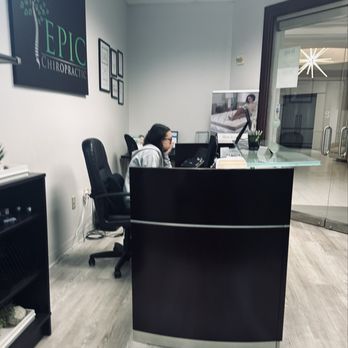 Epic Chiropractic - Bri working tentatively on the computer. - Chiropractors Near Me - Plano, Texas Epic Chiropractic - Bri working tentatively on the computer. - Chiropractors Near Me - Plano, Texas