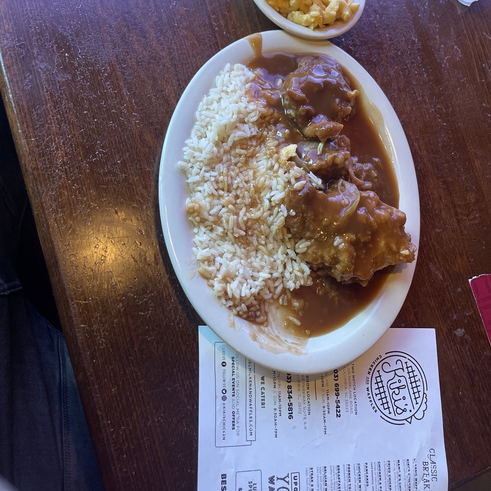 Kiki's Chicken and Waffles - Smothered chicken in brown gravy,onions and mushrooms with white rice and gravy also a side of Macaroni & Cheese - American Near Me - Columbia, South Carolina