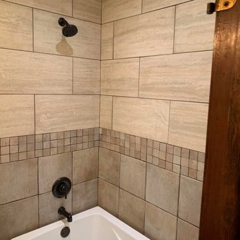 Transitions By Craftsmen - a bathtub and shower in a bathroom - Flooring Near Me - Council Bluffs, Iowa Transitions By Craftsmen - a bathtub and shower in a bathroom - Flooring Near Me - Council Bluffs, Iowa