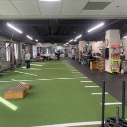 Physio Pro Powered By Evolution - Turf area loaded with equipment
