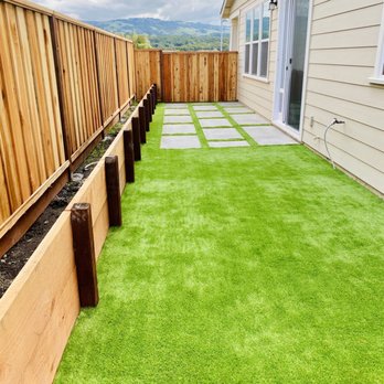 Guizar Landscaping - A look at the retaining wall with an area for our garden bed. Retaining Wall, Artificial Turf, Modern Concrete Squares. - Landscaping Near Me
