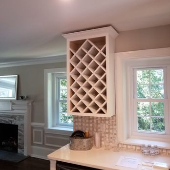 Fixit Construction - Custom wine rack built into existing cabinetry - General Contractors Near Me Fixit Construction - Custom wine rack built into existing cabinetry - General Contractors Near Me
