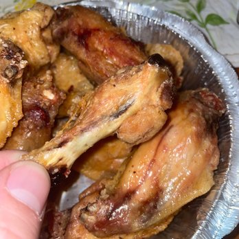 Bella Italia Pizza Restaurant - a hand holding a plate of chicken wings - Pizza Near Me - Oley, Pennsylvania Bella Italia Pizza Restaurant - a hand holding a plate of chicken wings - Pizza Near Me - Oley, Pennsylvania