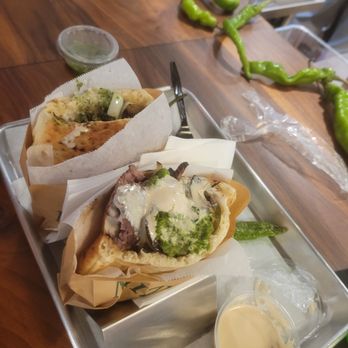 Miznon - Rotisserie broken chicken pita ($18.50) and lamb kabob pita ($19.00) - Venues & Event Spaces Near Me - Los Angeles, California