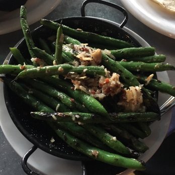 Bar Rio - Grilled Green Beans (Tossed w/ lemon, manchego, olive oil, almonds, crispy jamon) - Tapas Bars Near Me - Bend, Oregon Bar Rio - Grilled Green Beans (Tossed w/ lemon, manchego, olive oil, almonds, crispy jamon) - Tapas Bars Near Me - Bend, Oregon