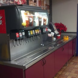 a soda dispenser in a restaurant a soda dispenser in a restaurant