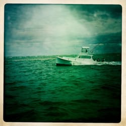 Albatross Fleet - One of the Albatross returning. Note the upside down Blue Marlin flag signifying a catch and release.