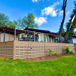 JTL Custom Builder - We added a linear wall under the deck to provide a finished look.   It turned out amazing!