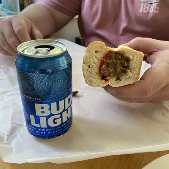 Jimmy's Pizza - Chelmsford - a man eating a hot dog and a can of bud light - Pizza Near Me - Chelmsford, Massachusetts Jimmy's Pizza - Chelmsford - a man eating a hot dog and a can of bud light - Pizza Near Me - Chelmsford, Massachusetts