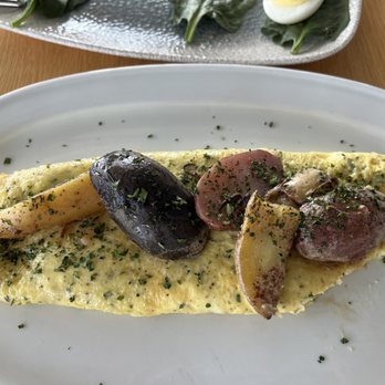 Nicolas Eatery - Toast and Eggs: French Boursin Omelet.... After I had a corner!!!  Lol.  5.31.2023. - French Near Me - Los Angeles, California